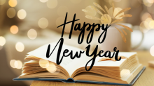 Open book with black font Happy New Year